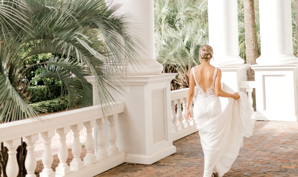 bride walking on an outside patio at Sandestin Golf and Beach Resort. 
