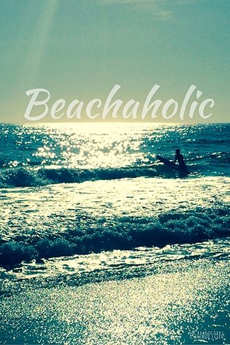 Surfer in the waves with "Beachaholic."