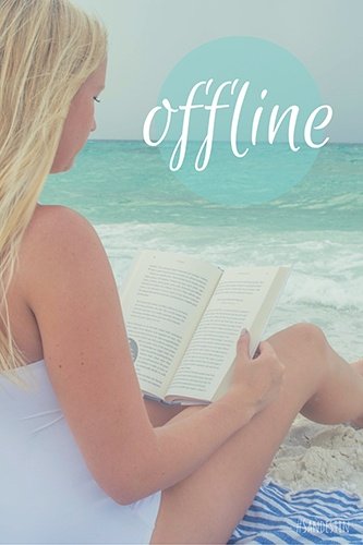 Woman reading a book and "Offline"