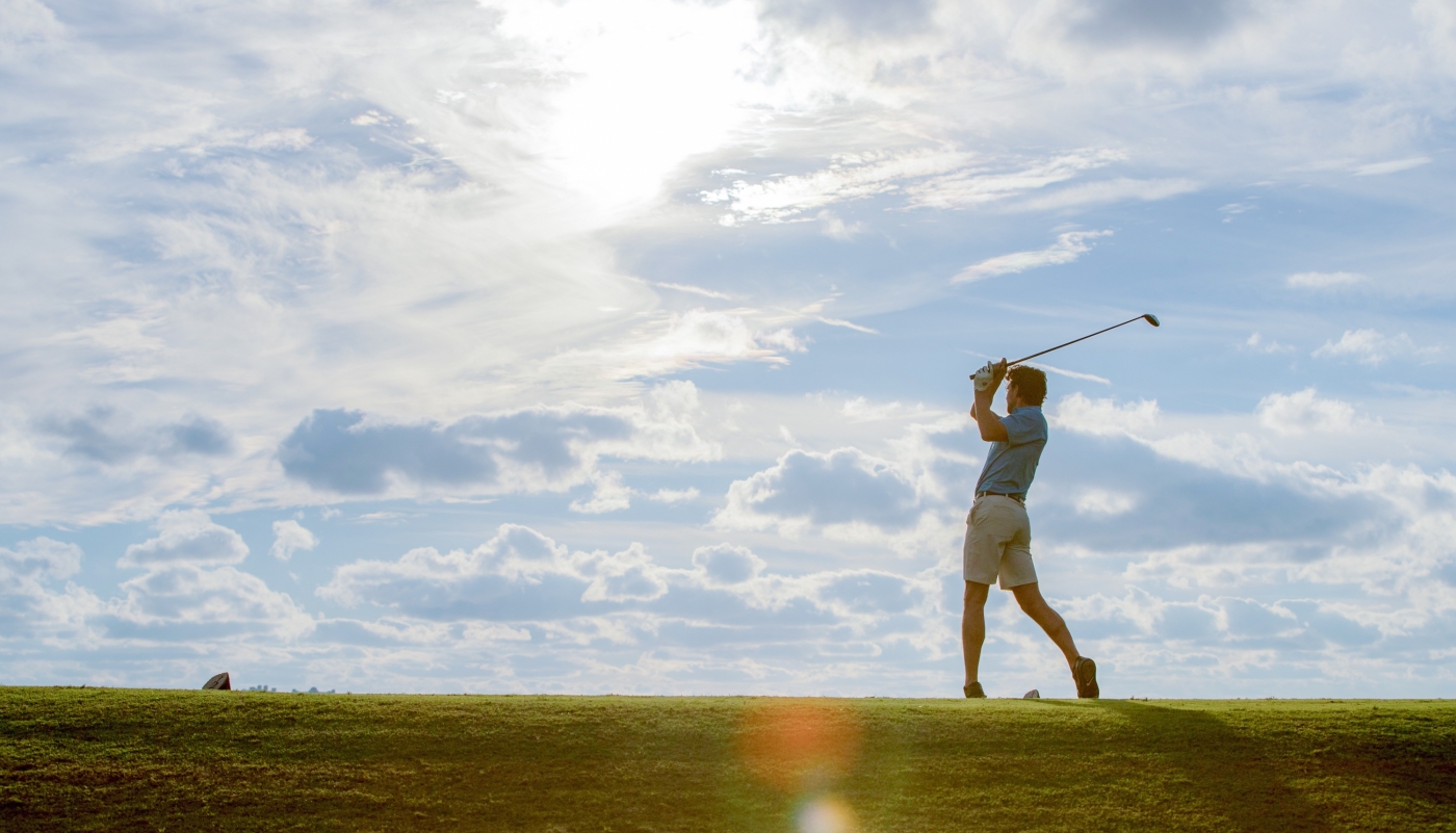 Man playing golf