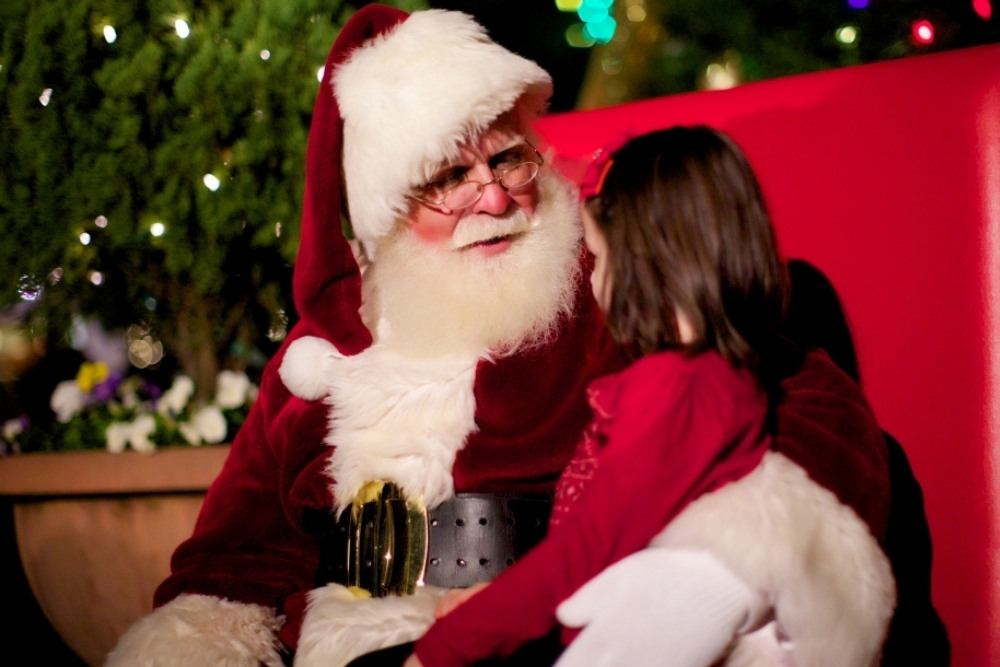 Santa talking to a little girl