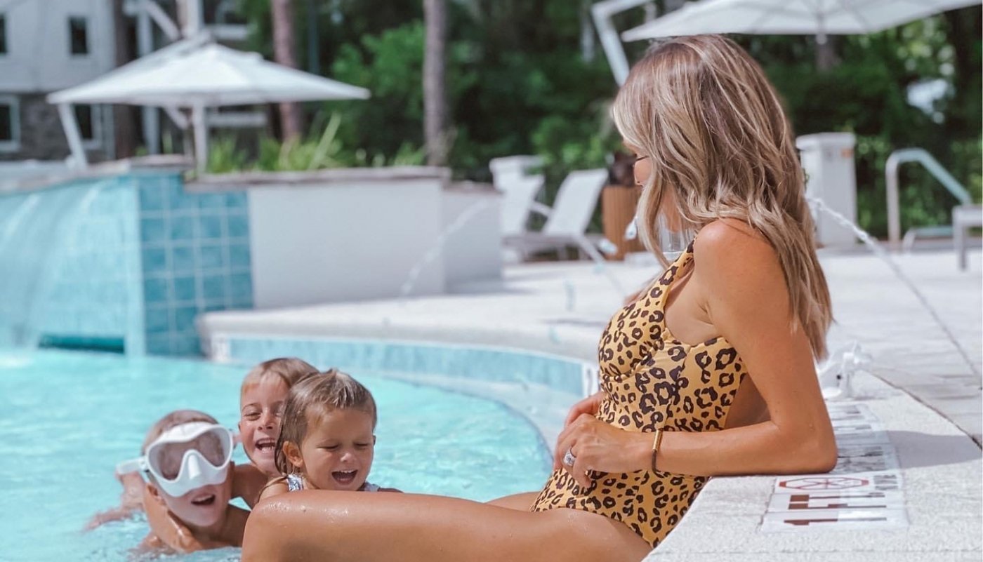 Jessica Fay lounging at the pool with children