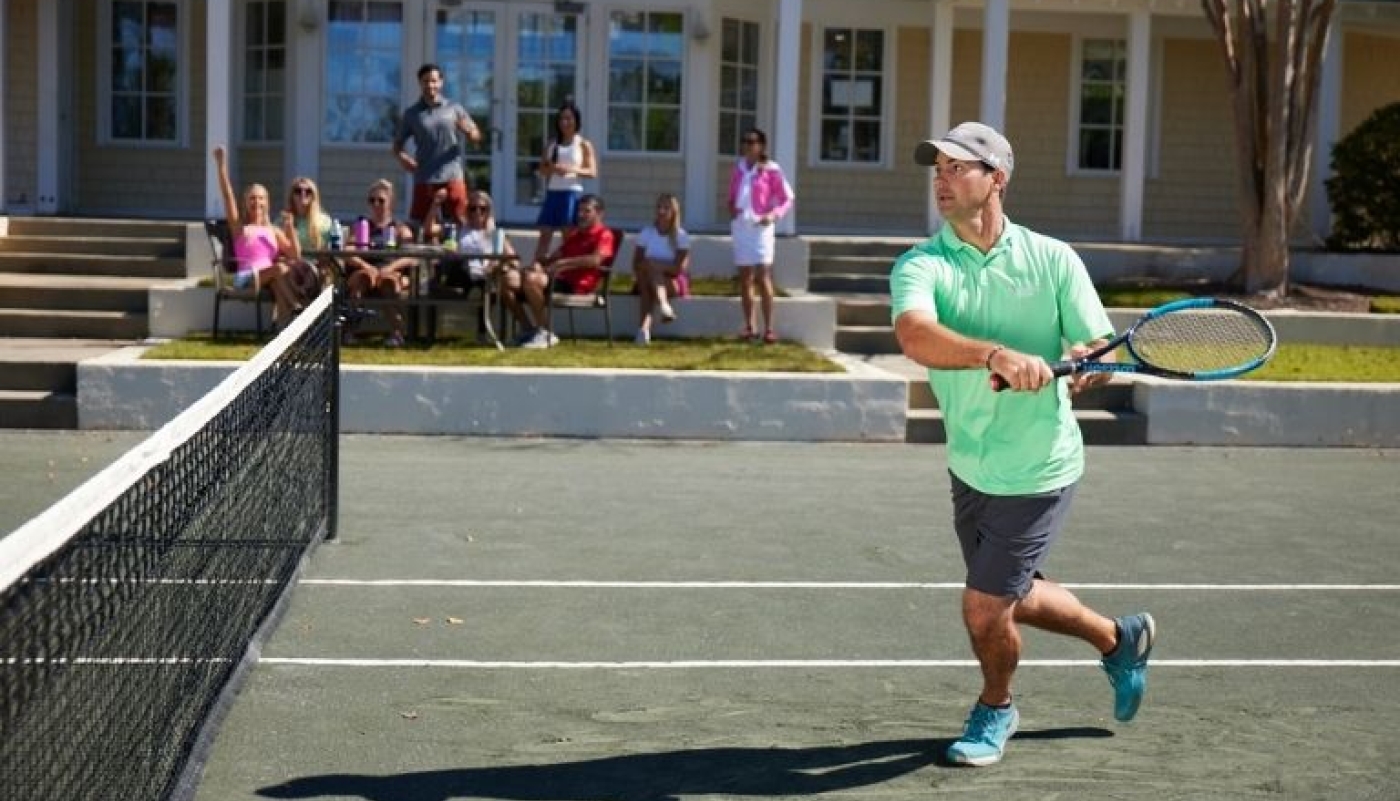 Tennis match with people cheering
