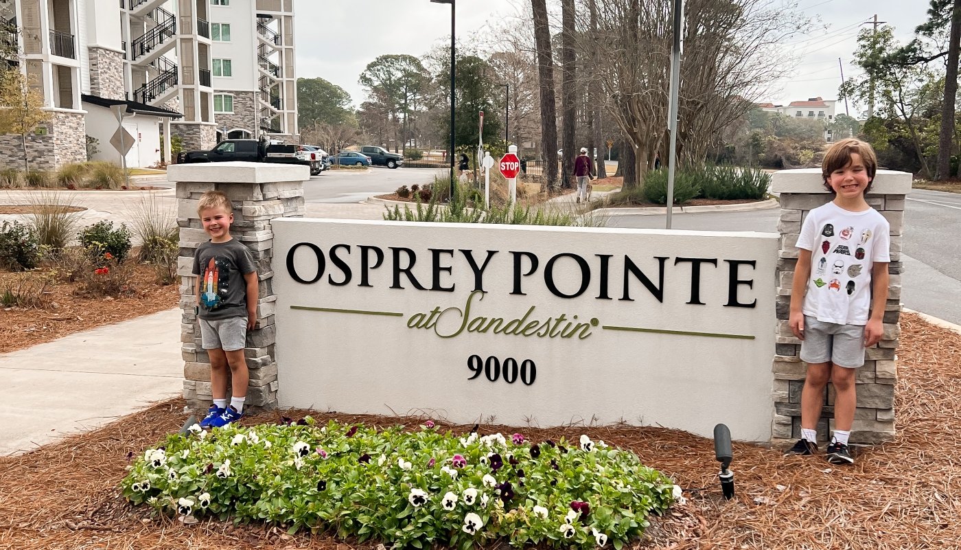 Kids in front of sign