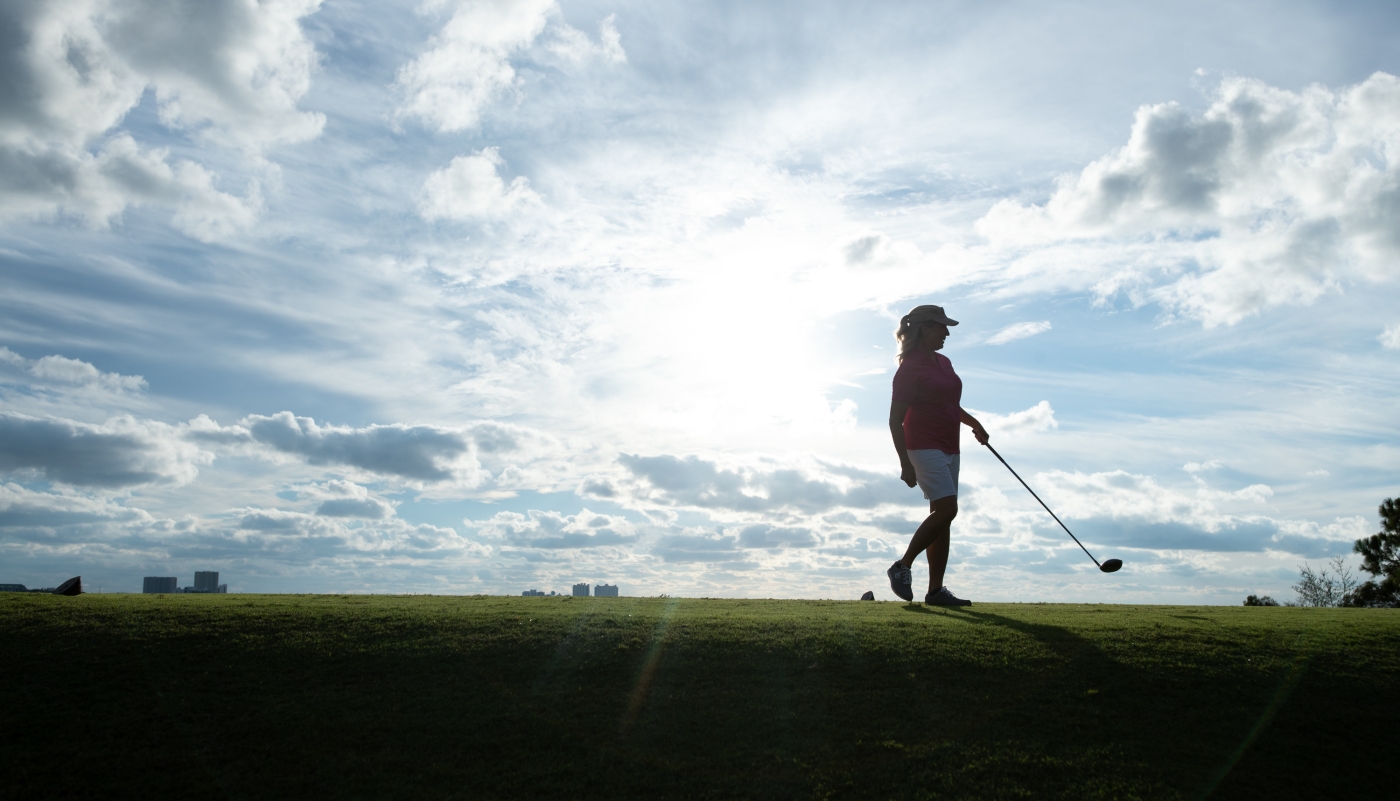 Woman playing golf
