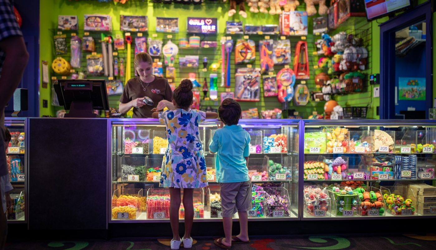 kids claiming prizes at arcade