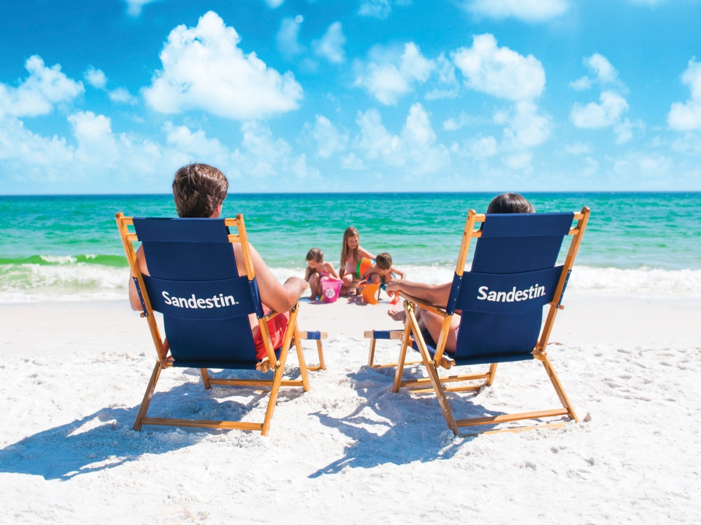 Family relaxing on the beach