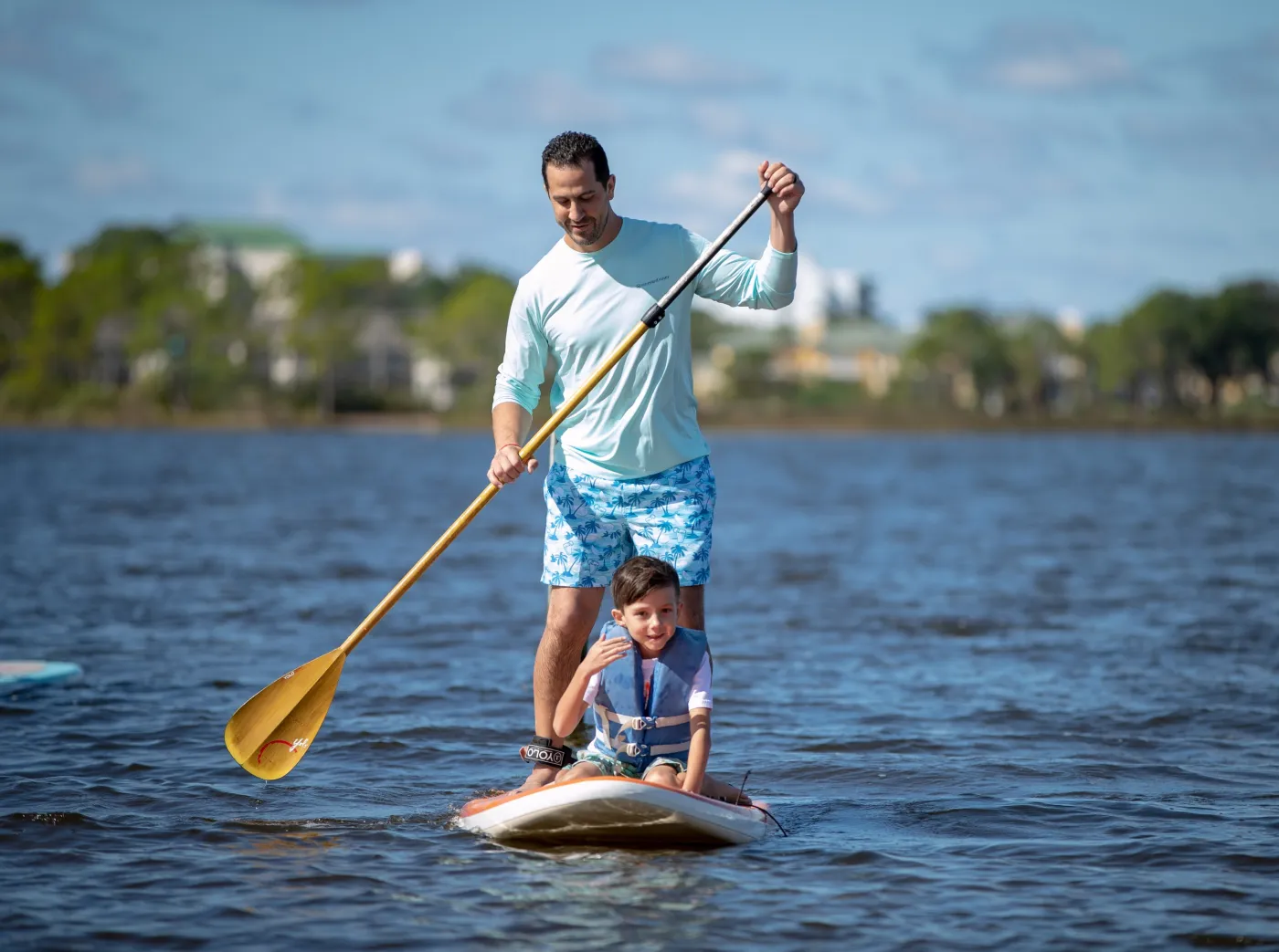 Father and son paddlebaording
