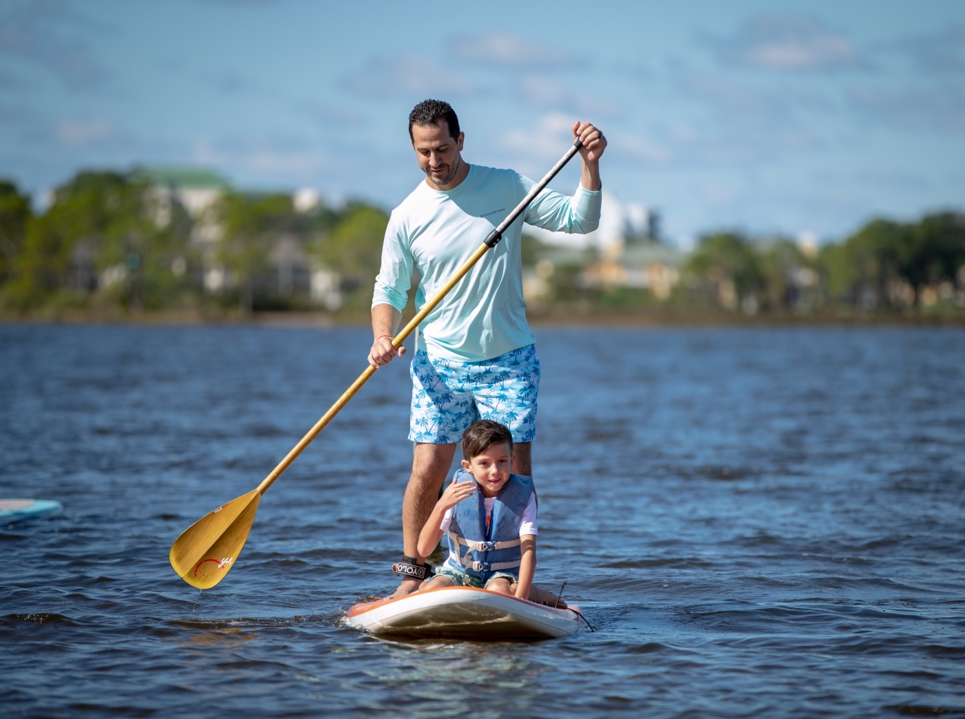 Father and son paddlebaording