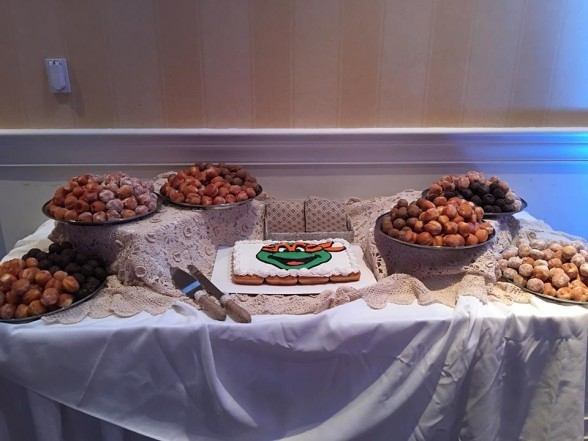 A cake made out of multiple donuts