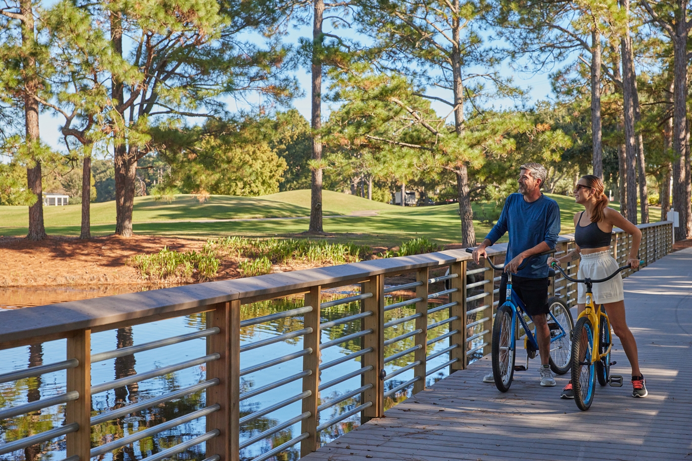 Couple biking on resort