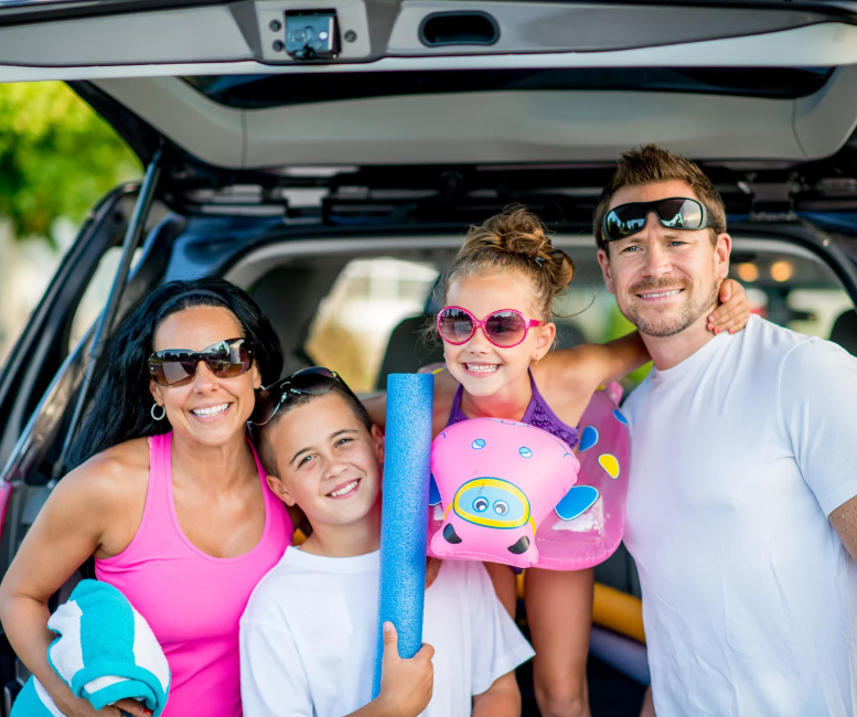 Family getting ready to go swimming.