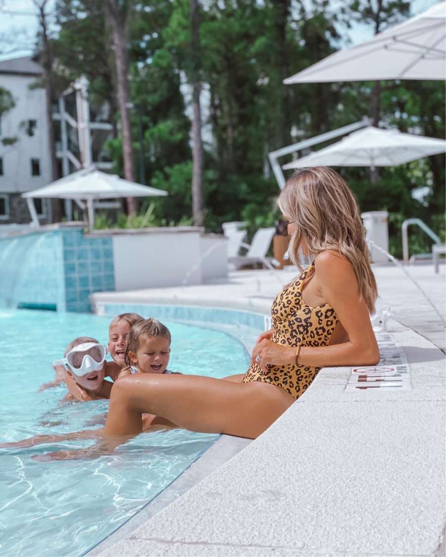Jessica Fay lounging at the pool with children
