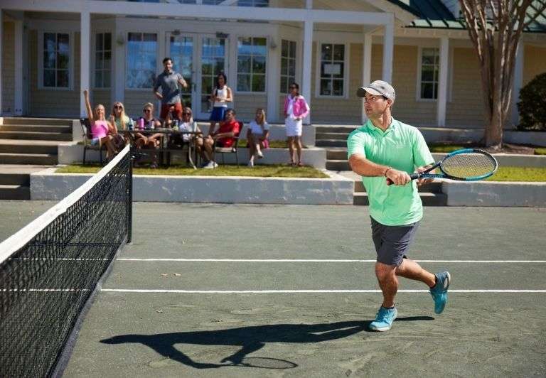 Tennis match with people cheering