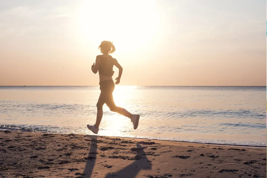 Woman running on beach