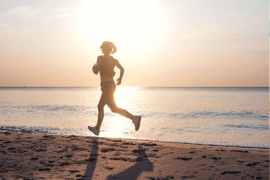 Woman running on beach