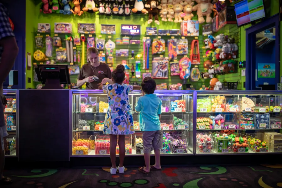 kids claiming prizes at arcade