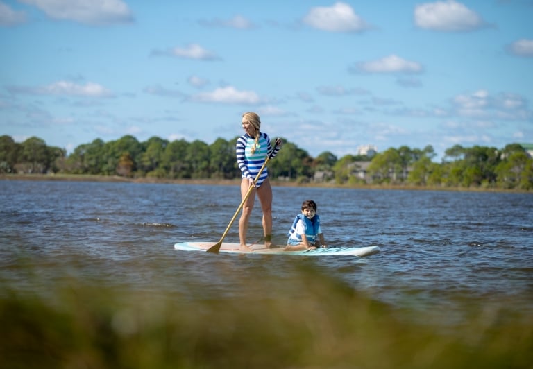 woman and child paddleboarding