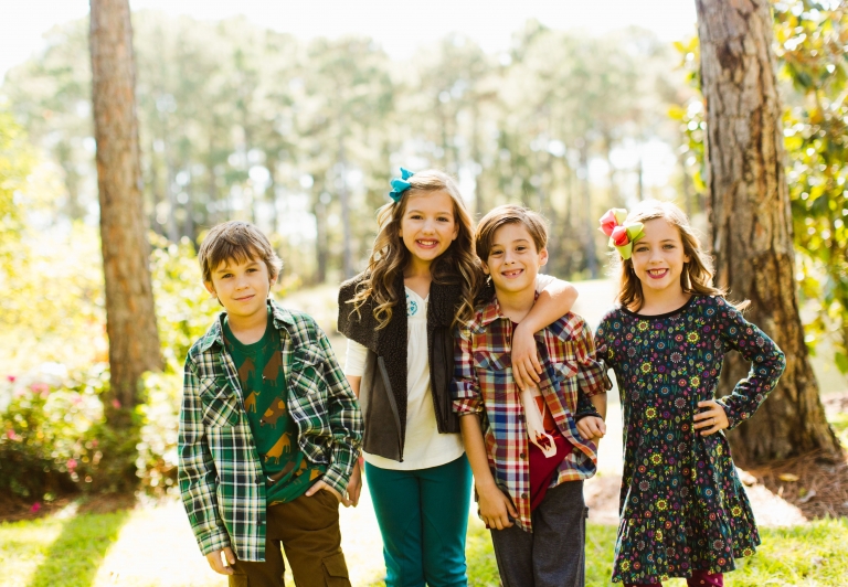 Four children dressed in clothing from coconut kidz at Sandestin Golf and Beach Resort