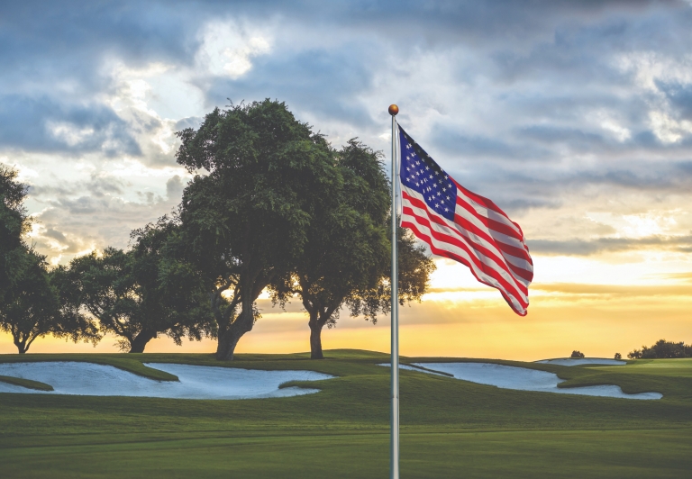 golf course with the American flag in the foreground