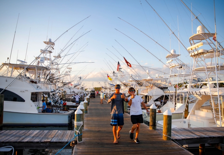 Two men walking along the marina at Sandestin Golf and Beach Resort