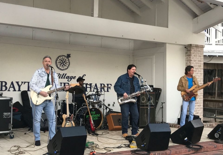 The blenders playing at an outdoor concert at Sandestin Golf and Beach Resort