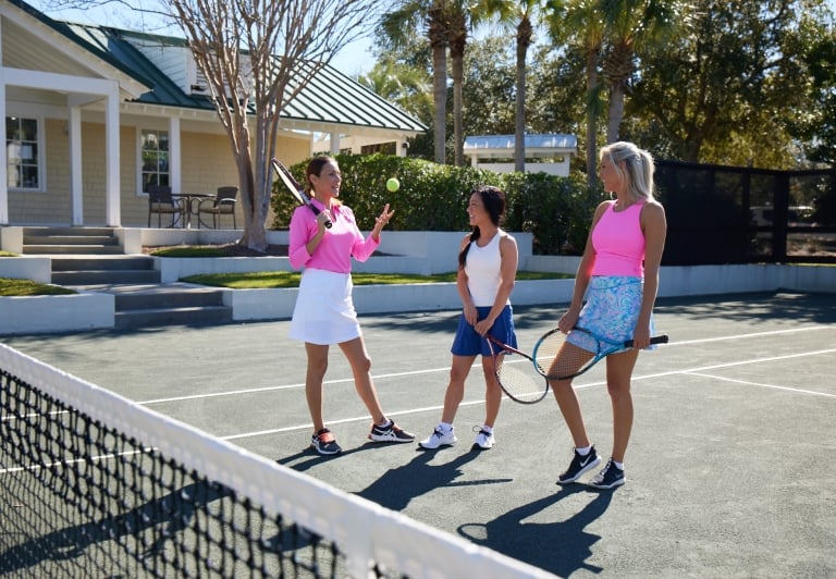 Three ladies on the tennis court