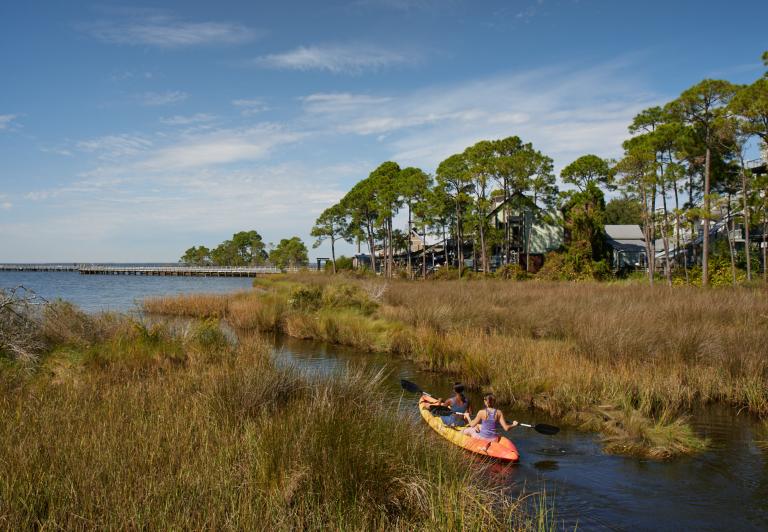 Girls kayaking in the bay