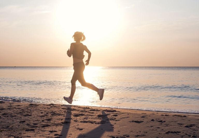 Woman running on beach
