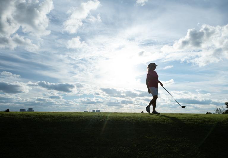 Woman playing golf
