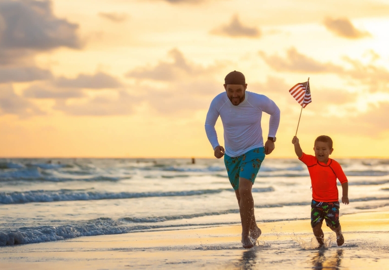Boy running with American Flag
