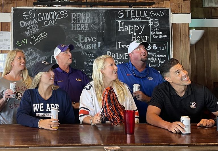 Patrons watching football
