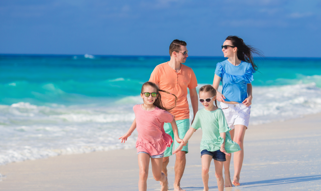 family walking on the beach