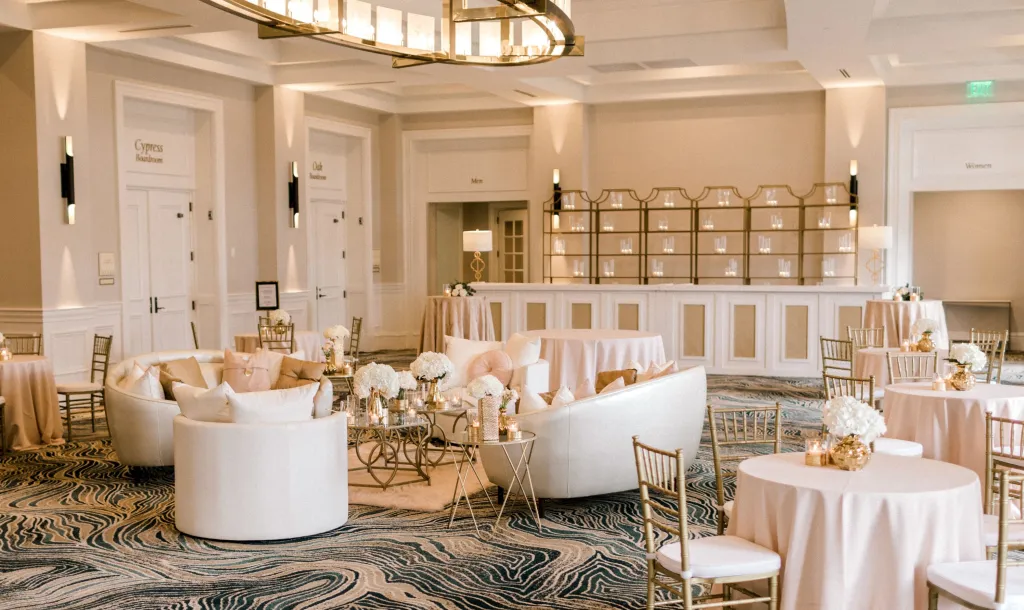 Azalea Ballroom set up for a wedding with white tables and chairs