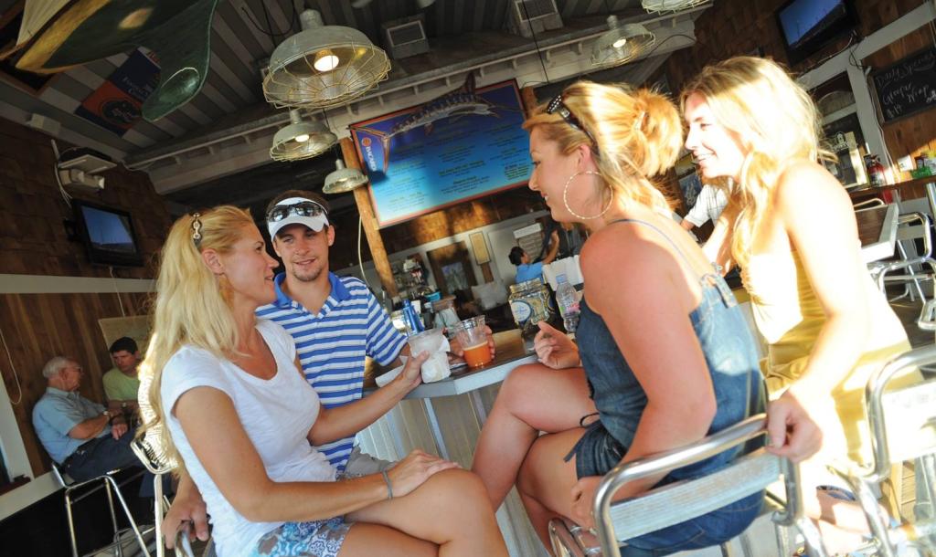 a group of friends gather at Marina Bar & Grill