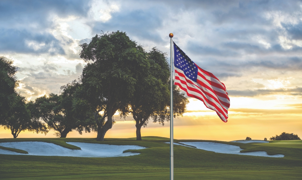 golf course with the American flag in the foreground