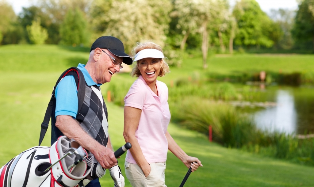 older couple playing golf
