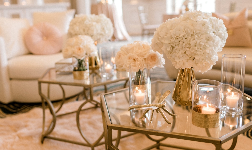 Wedding reception set up with glass tables and flowers