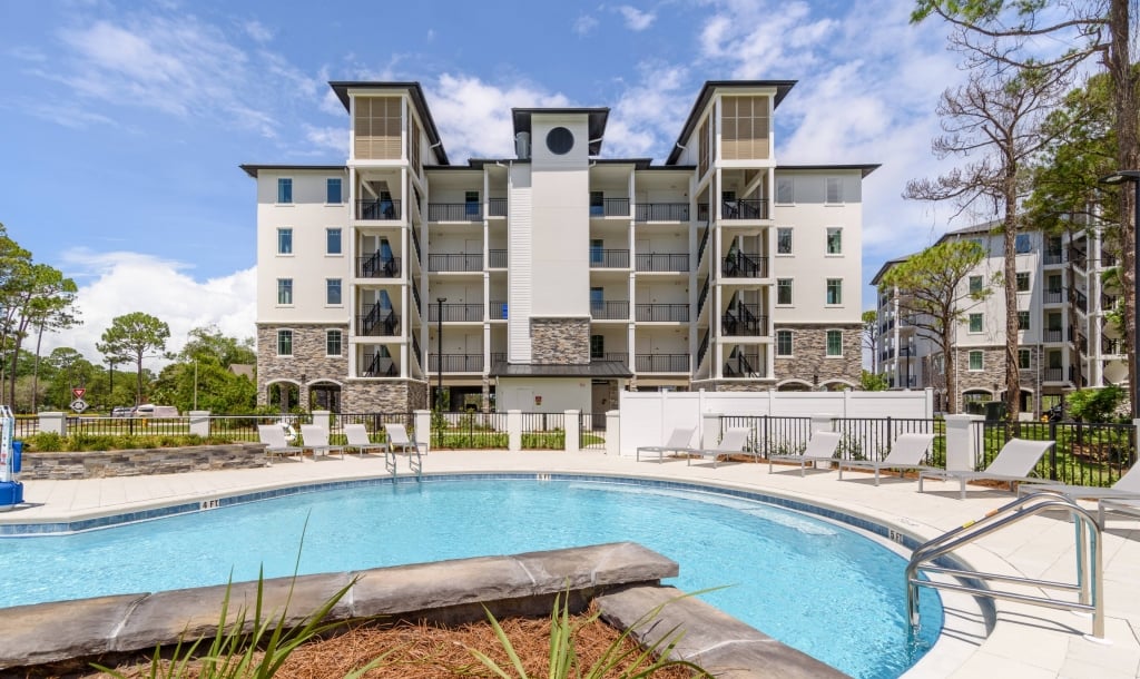 Exterior of Osprey Pointe with the pool in the foreground