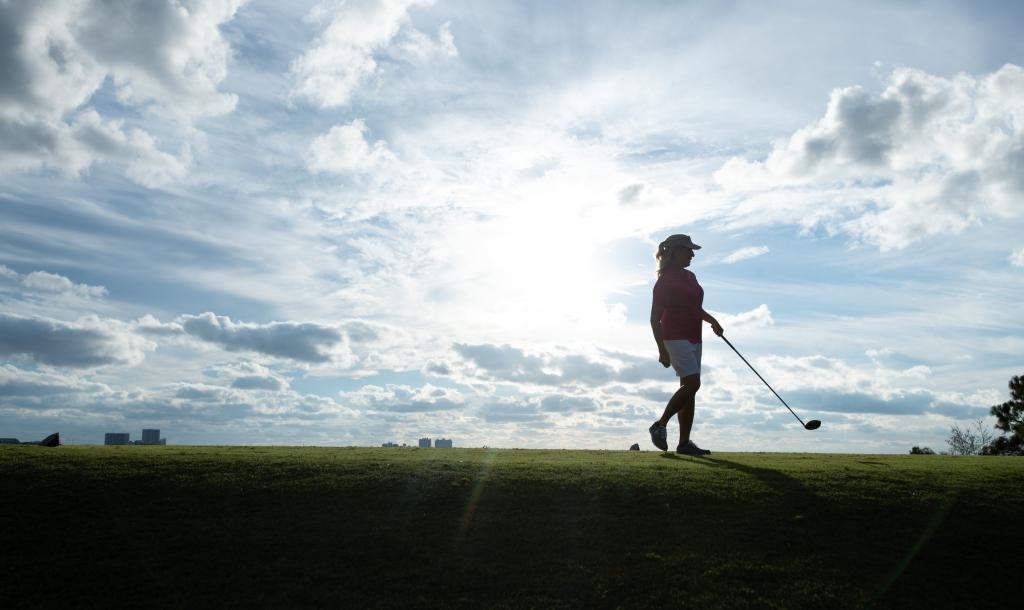 Woman playing golf