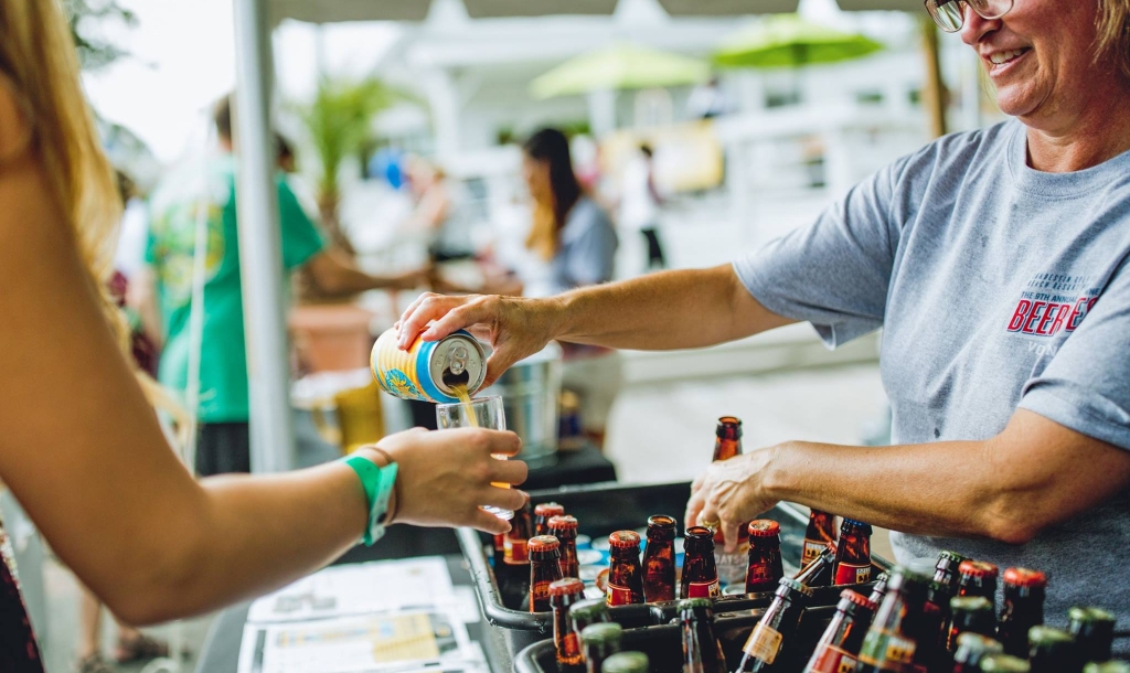 Woman pouring a beer sample