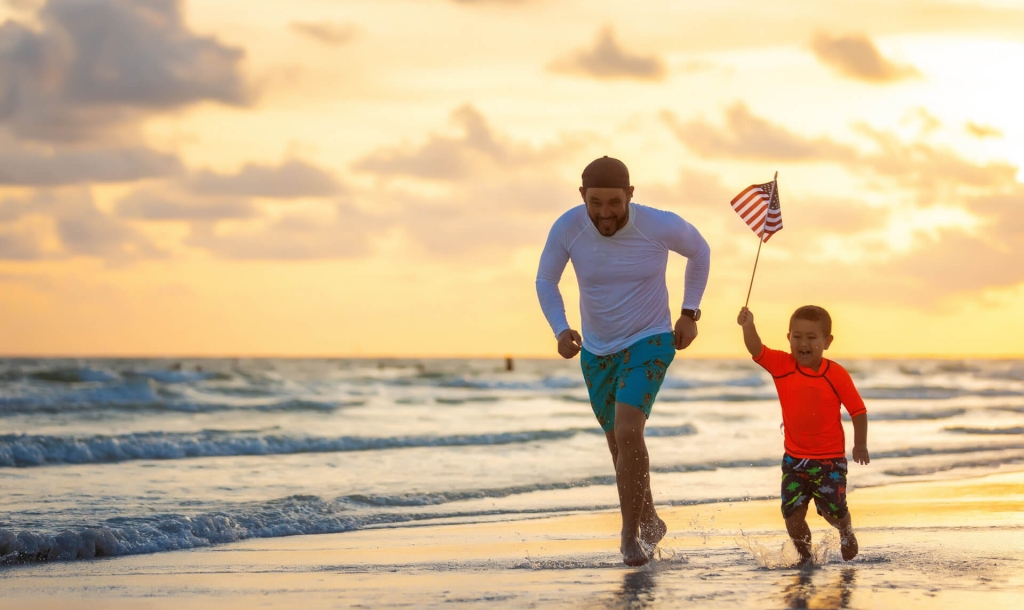Boy running with American Flag