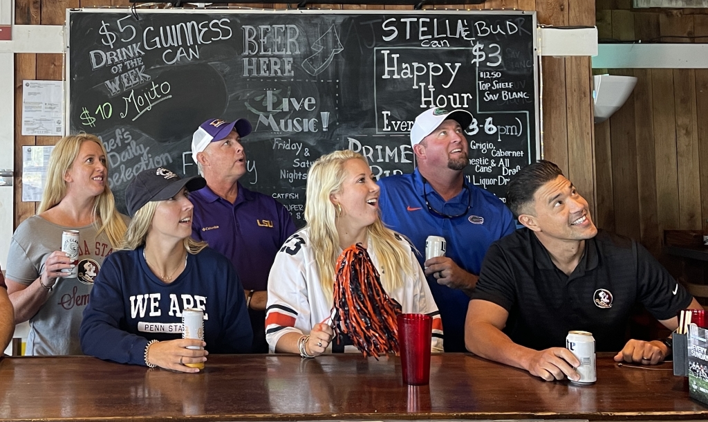 Patrons watching football