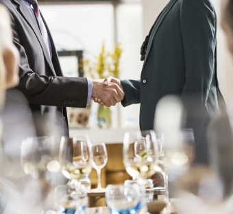 a meeting with people shaking hands