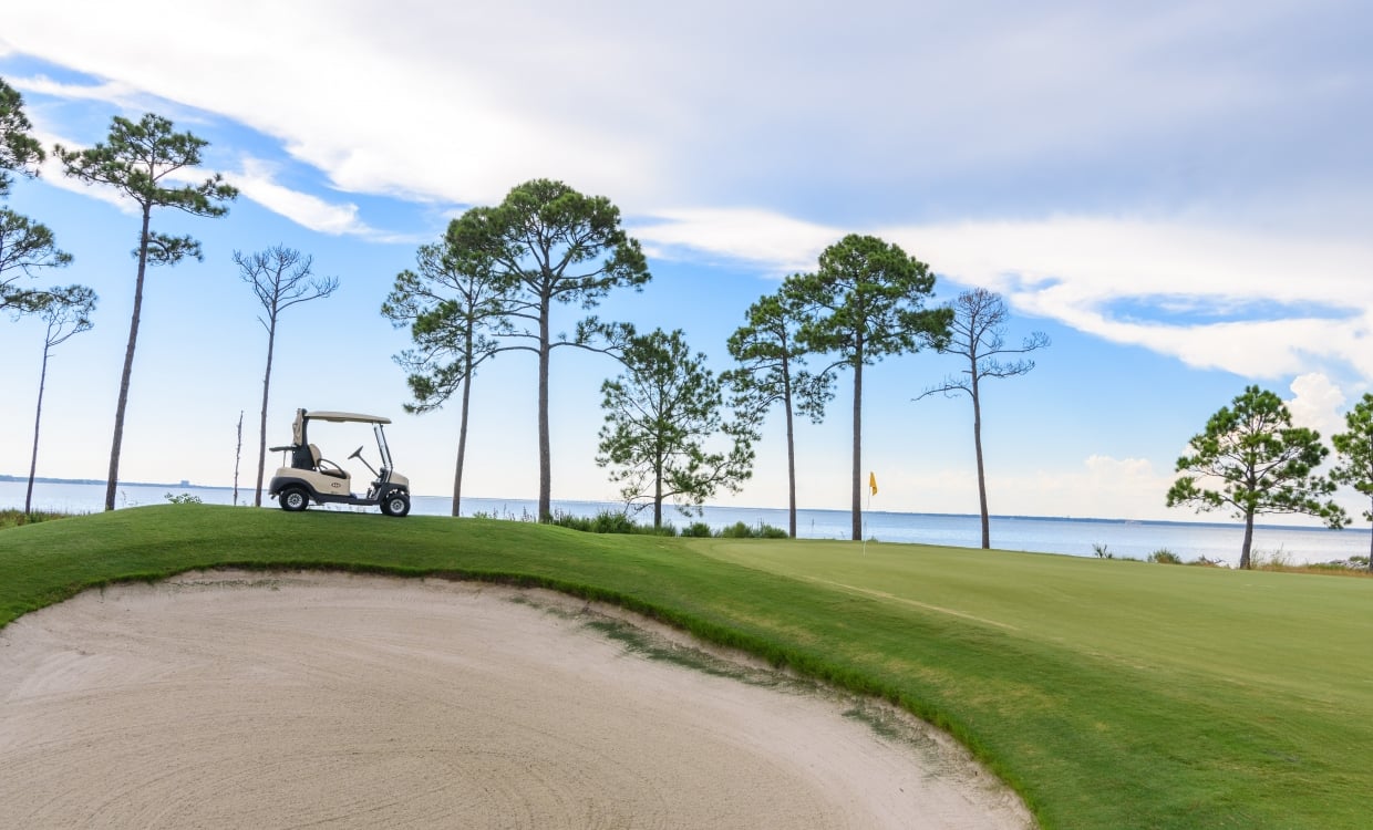 sand trap and golf cart at sandestin golf and beach resort golf course