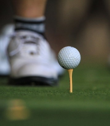close up of a golf ball on a golf tee